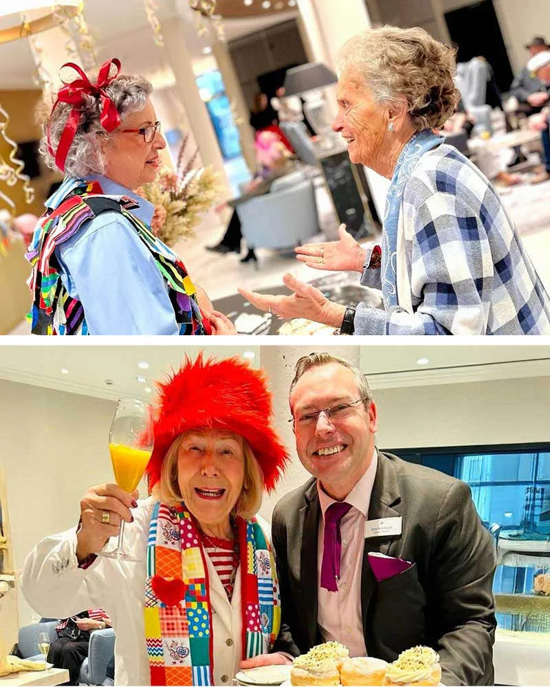 Zwei Bewohnerinnen verkleidet im Austausch in der wunderschönen Lobby in SCHÖNES LEBEN Erftstadt. Resident Manager Dirk Reinhardt mit Berliner und verkleidete Bewohnerin passend zum Karneval.