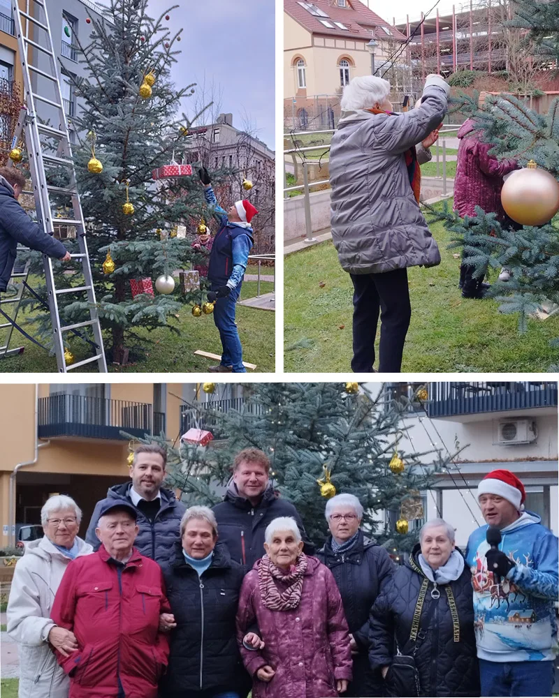 Bewohner schmücken Weihnachtsbaum im Innenhof
